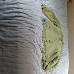 An olive sweater